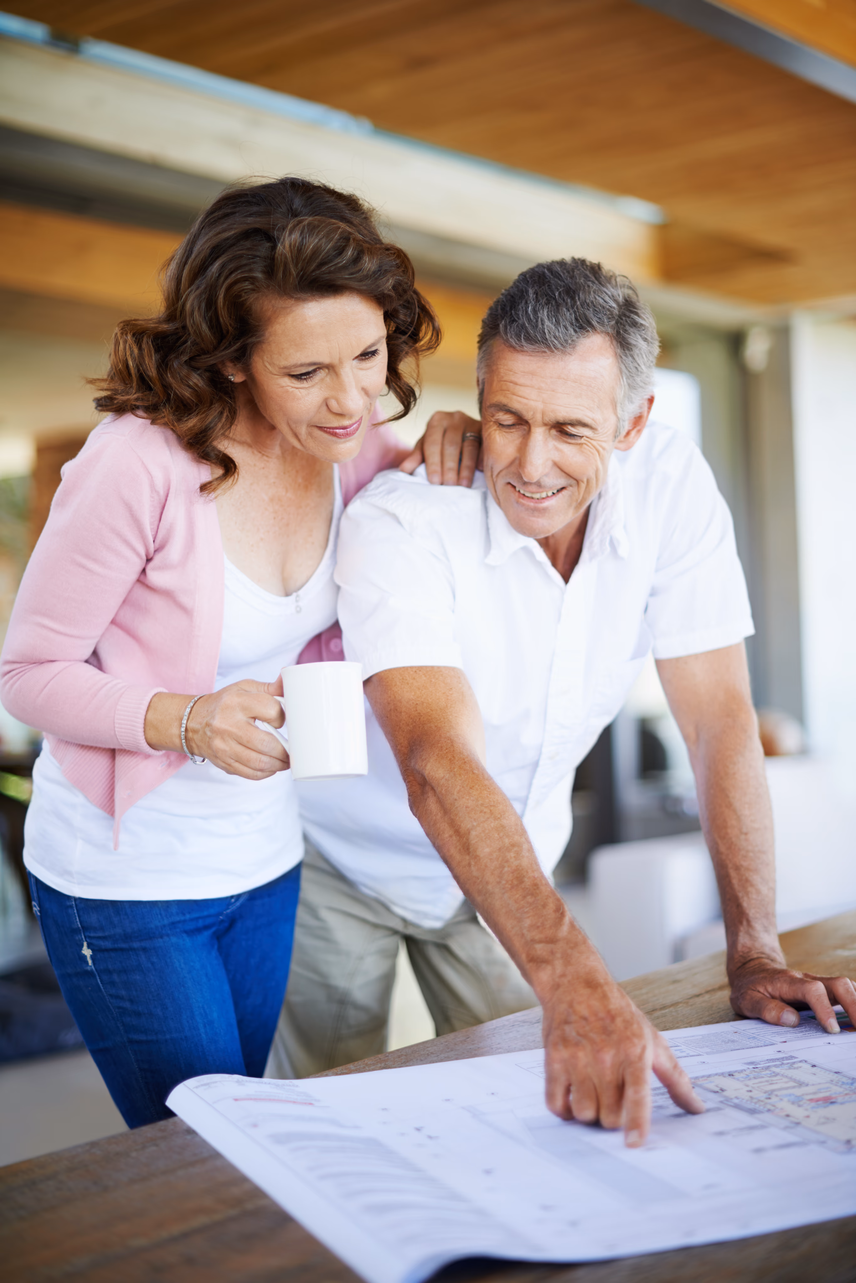 Homeowners reviewing plans